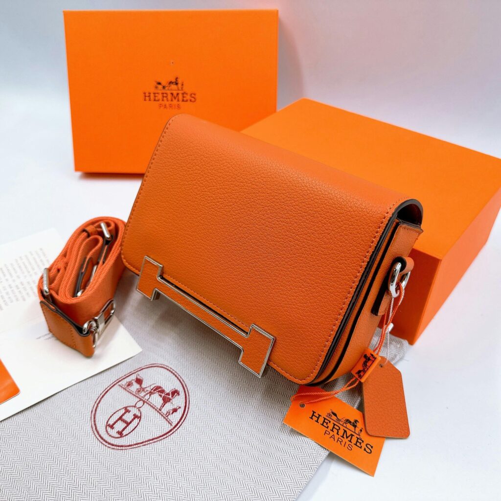 Hermes Luxurious Leather Purse Hermès Birkin bag displayed in luxury boutique, exemplifying exclusive branding strategy.