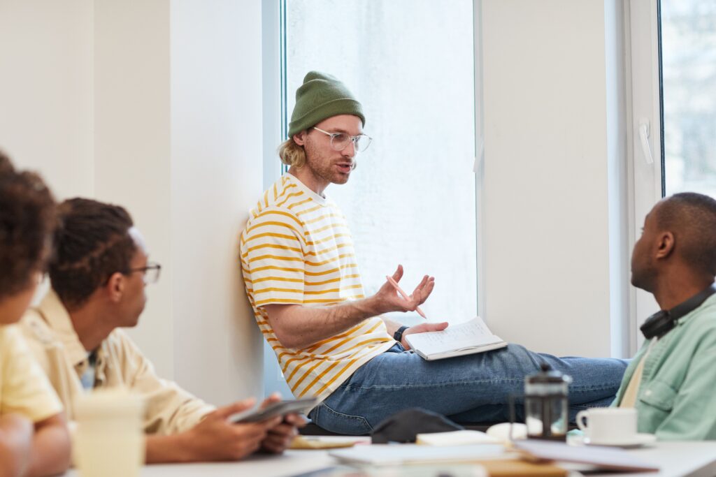 Business owner listening closely to a customer during a conversation, representing how brand strategy starts with listening